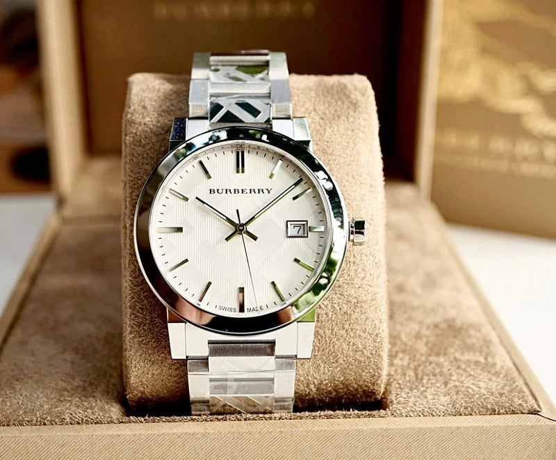 Burberry BU9037 unisex silver watch placed on branded pillow for elegant display