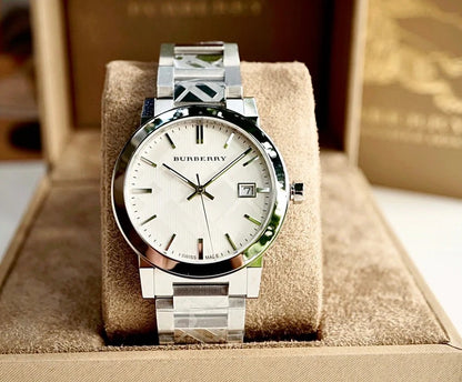 Burberry BU9037 unisex silver watch placed on branded pillow for elegant display