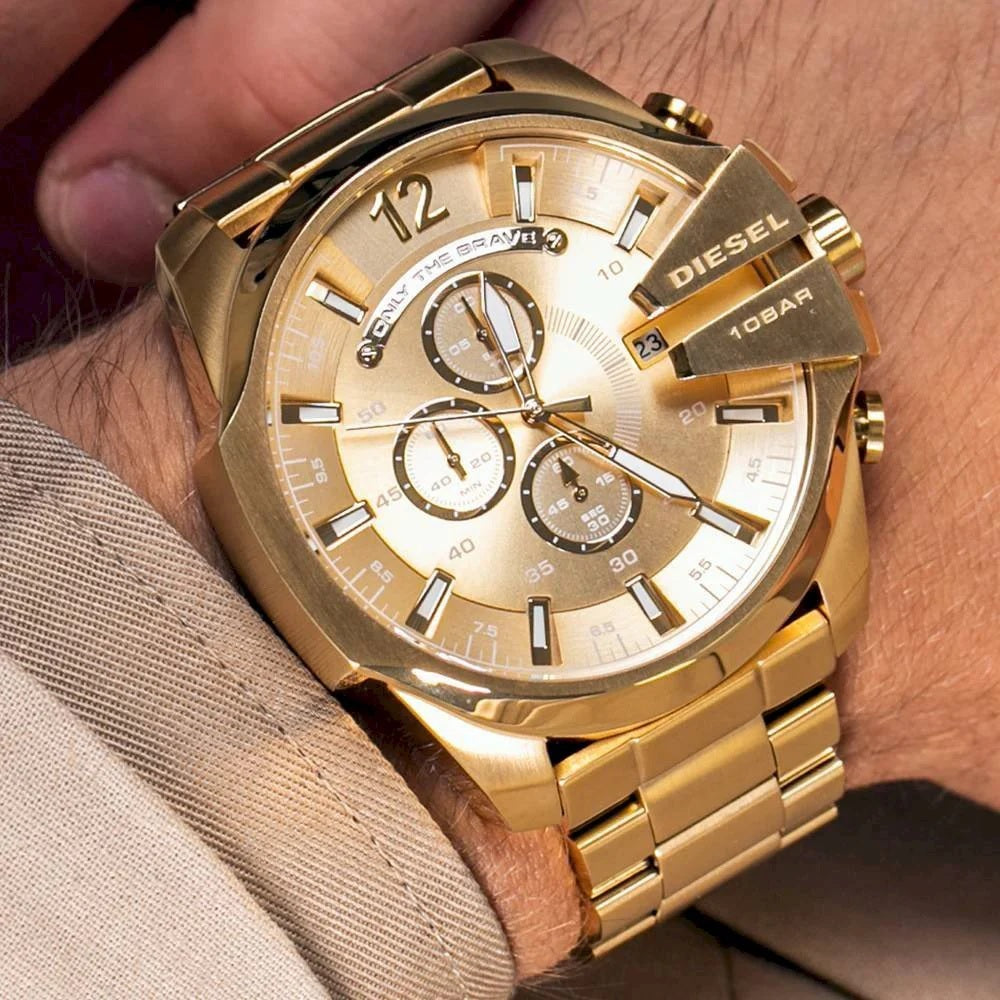 Close-up shot of the Diesel DZ4360 gold watch on a man's wrist, demonstrating the bold 51mm scale and metallic shine.