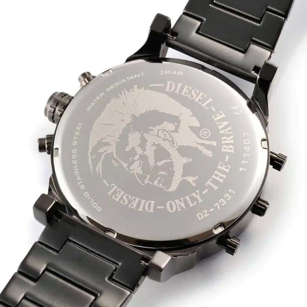 Close-up of the solid stainless steel case back of the Diesel DZ7331 watch featuring the engraved Only The Brave logo.