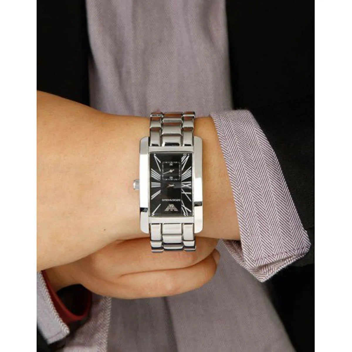 Emporio Armani AR0156 men's rectangular watch worn on wrist, showcasing the stainless steel silver strap and black dial