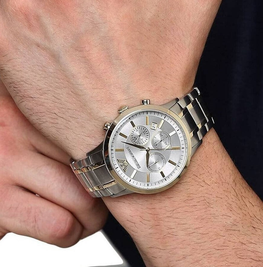 Close-up wrist shot of Emporio Armani AR11076 with silver dial and two-tone strap