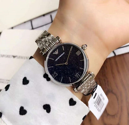 Close-up wrist shot of Emporio Armani AR11091 with blue dial and silver strap