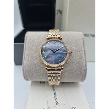 Emporio Armani AR11145 displayed on branded pillow with rose gold strap and black dial