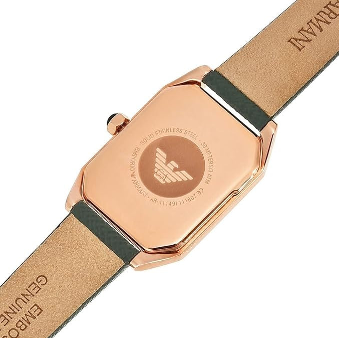Close-up of the solid rose gold-tone case back of the Emporio Armani AR11149 watch displaying the signature eagle logo.
