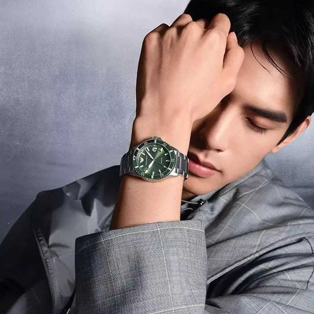 Wide wrist shot of Emporio Armani AR11338 showing full silver strap and diver bezel