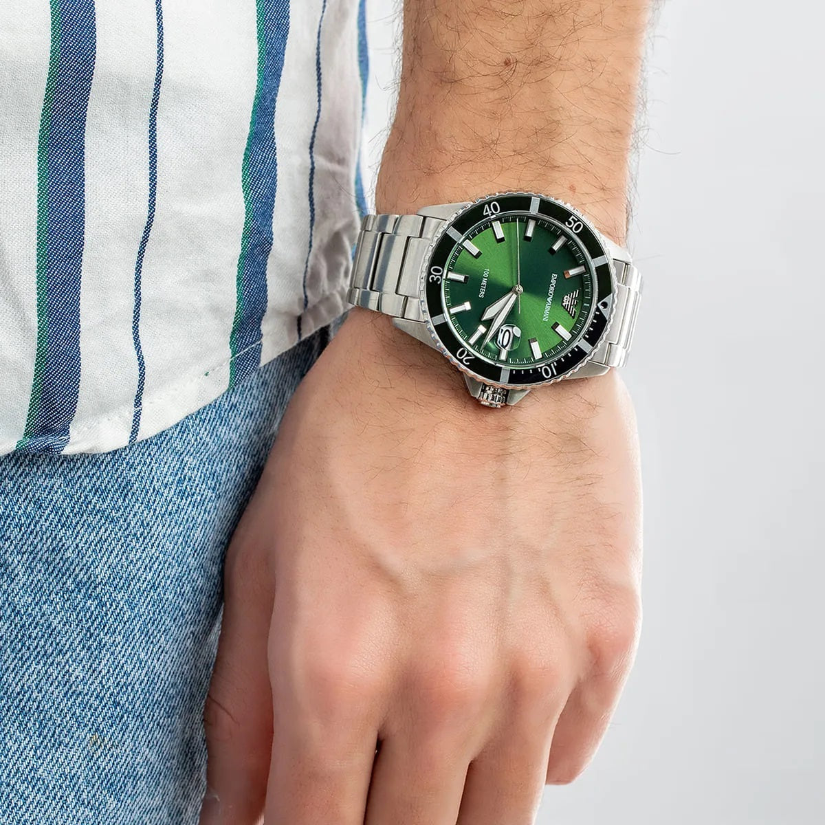 Wrist shot of Emporio Armani AR11338 men’s diver watch with green dial