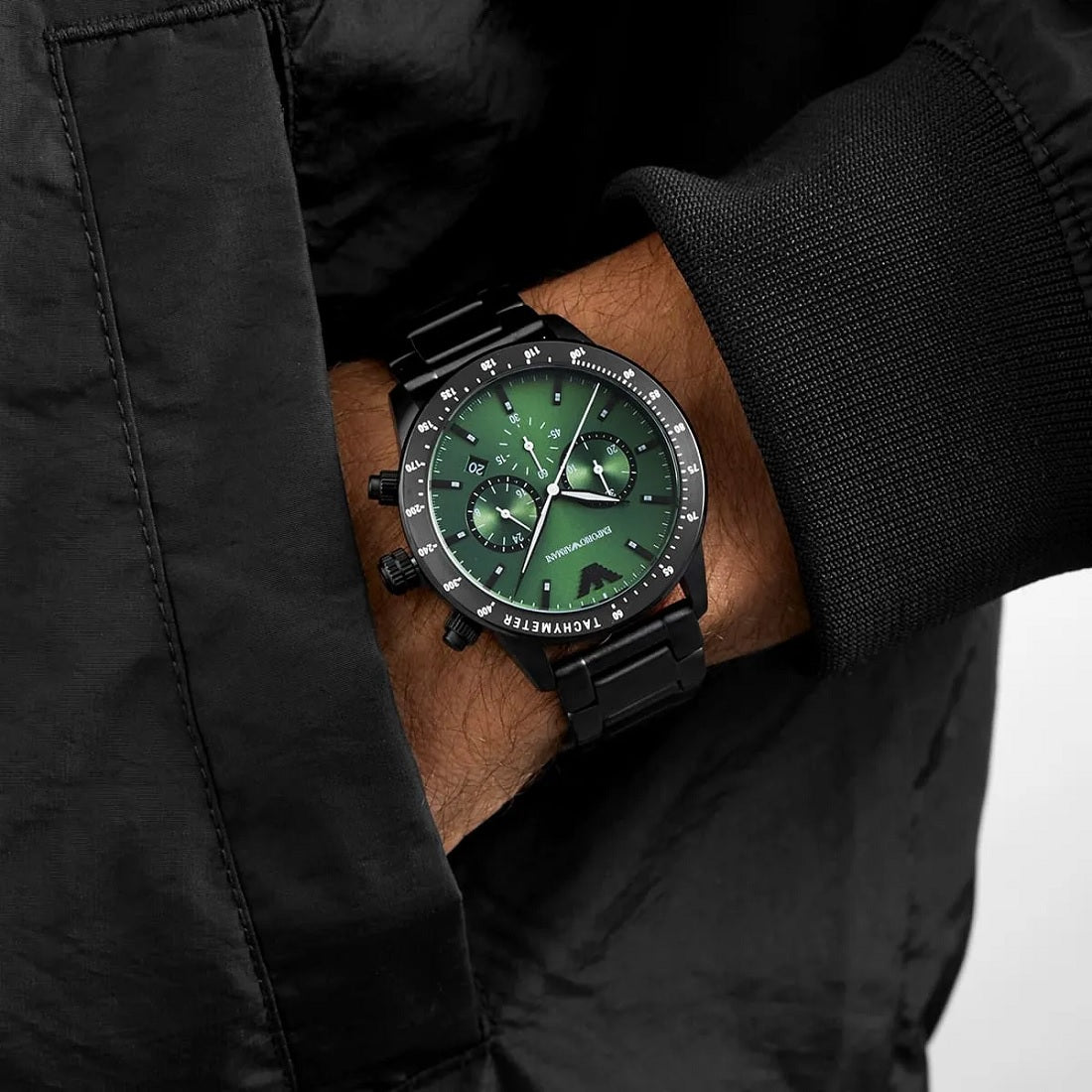 Close-up wrist shot of Emporio Armani AR11472, showing off its vibrant green dial and black strap