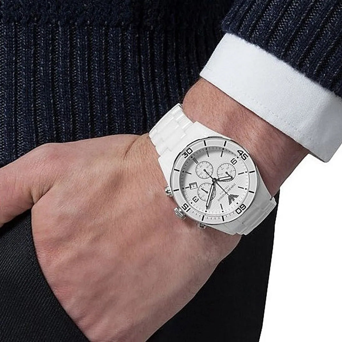 Emporio Armani AR1424 men's watch worn on wrist, featuring a white ceramic strap and clean white dial