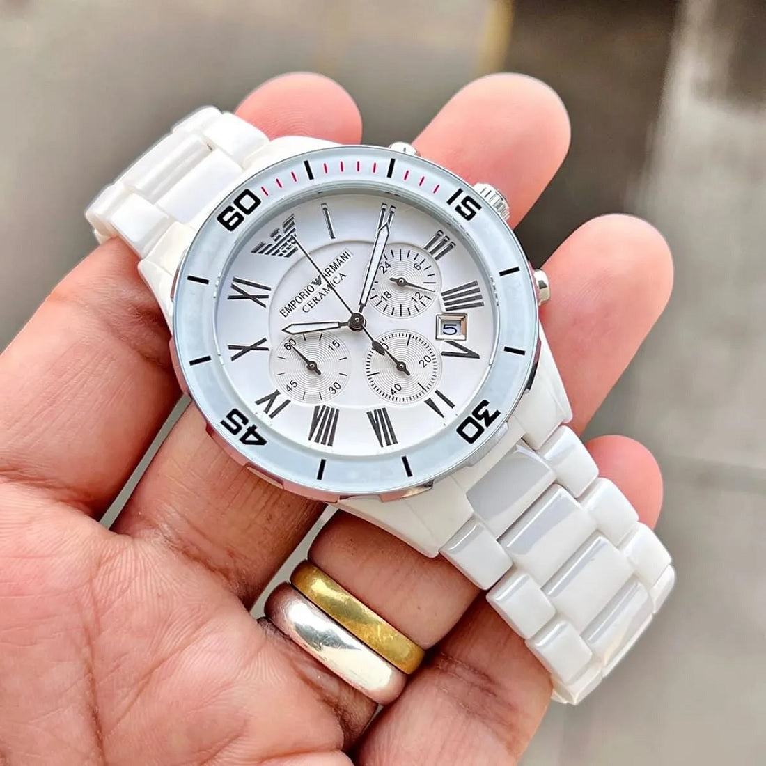 Close-up of the white ceramic dial on the Emporio Armani AR1424 men's watch