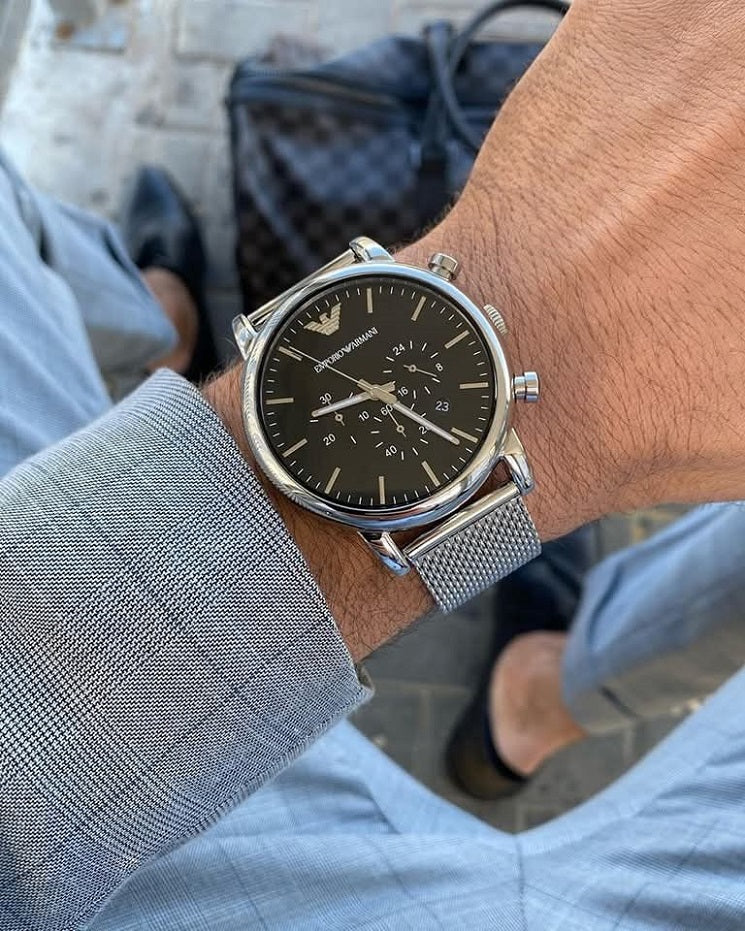 Emporio Armani AR1808 men’s silver watch worn on wrist with black dial