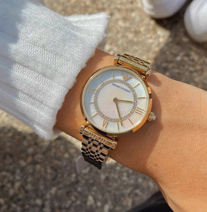 Full wrist image of Emporio Armani AR1907 with elegant gold bracelet and refined design