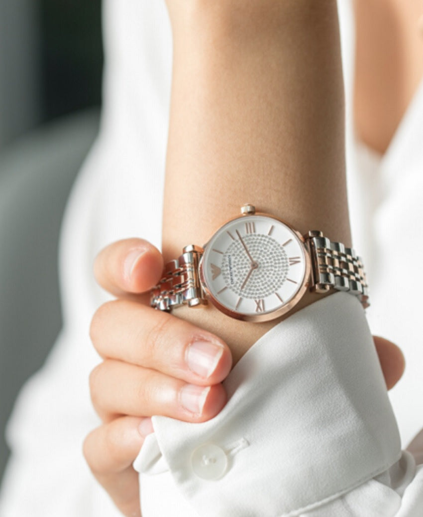 Emporio Armani AR1926 worn on wrist with refined two-tone bracelet and feminine crystal dial
