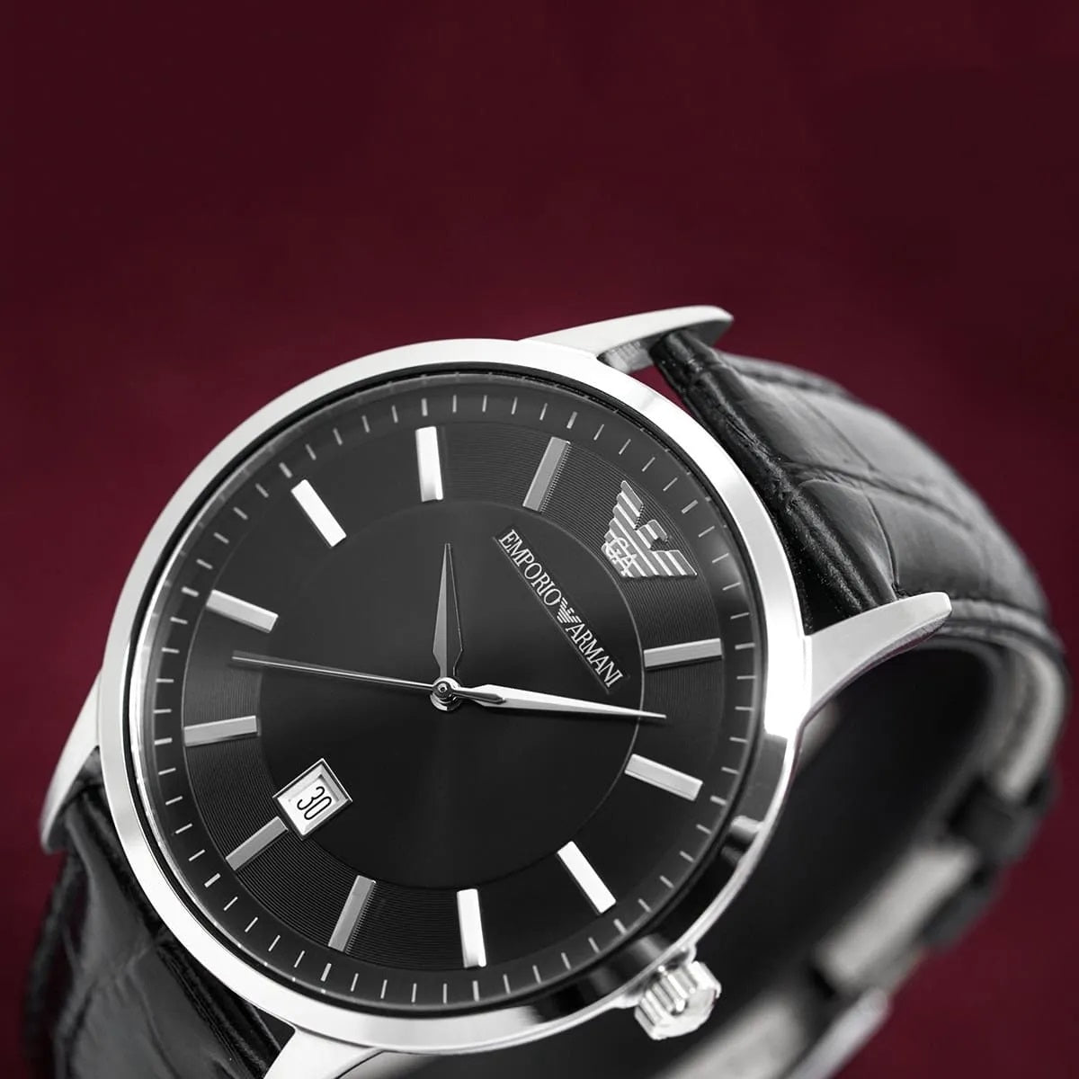 Close-up of Emporio Armani AR2411 featuring black face and black leather strap