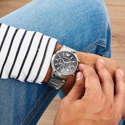 Emporio Armani AR2434 worn on wrist showing black dial and silver-tone bracelet