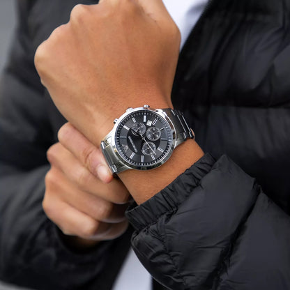 Close-up wrist shot of Emporio Armani AR2460 with black dial and silver bracelet