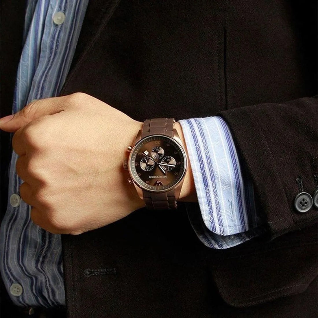 Close-up wrist shot of Emporio Armani AR5890 with brown dial, rose gold case, and brown silicone strap