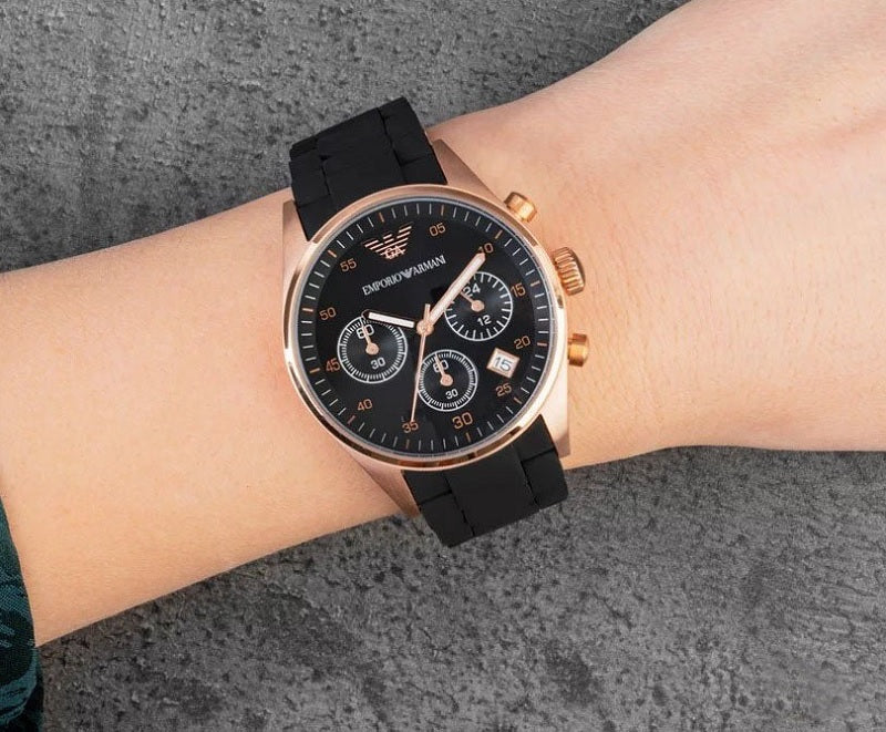 Emporio Armani AR5906 worn on wrist with black silicone strap and rose gold case
