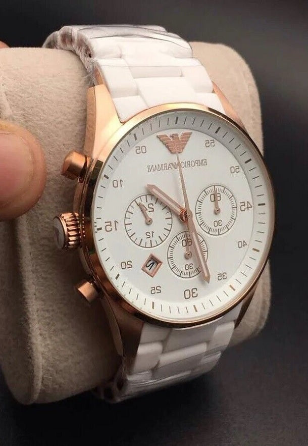 Emporio Armani AR5919 Sportivo men’s watch displayed on branded pillow with white silicone strap and gold case