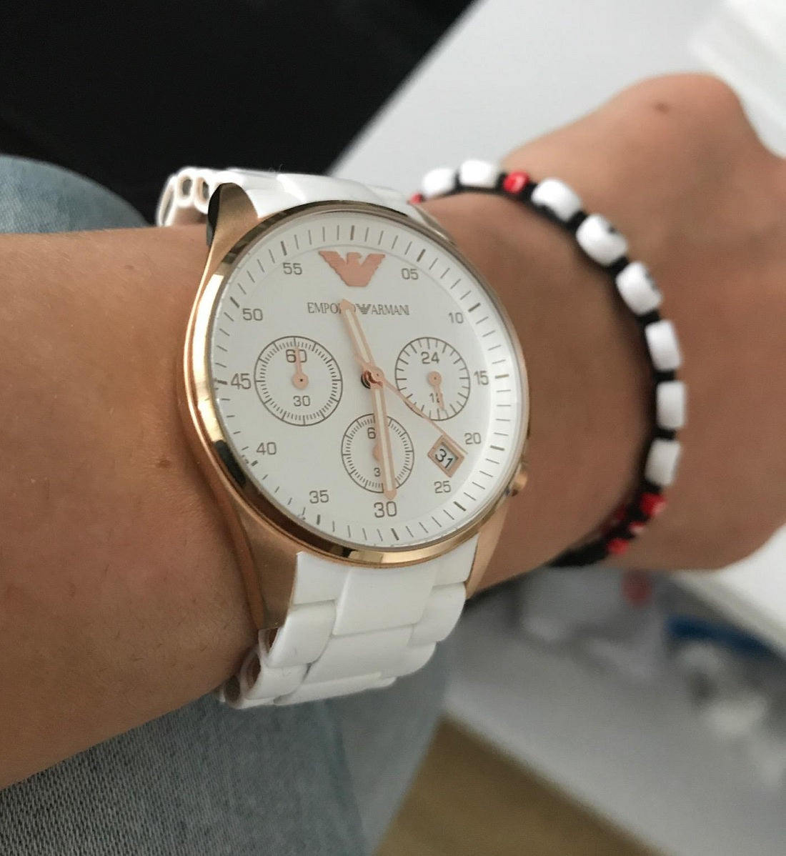 Emporio Armani AR5920 worn on wrist with white silicone strap and rose gold case