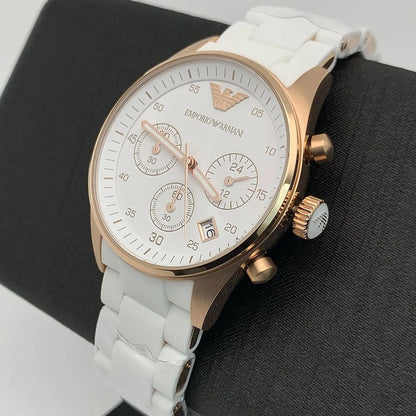 Emporio Armani AR5920 Sportivo women’s watch displayed on branded pillow with white silicone strap and rose gold case