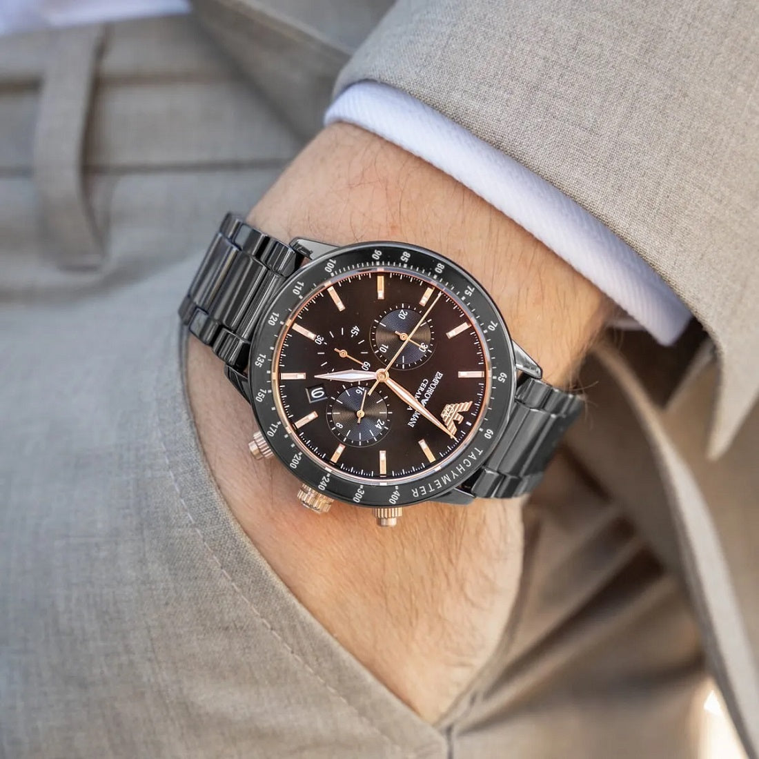 Emporio Armani AR70002 worn on wrist, displaying the stylish ceramic black strap and black dial