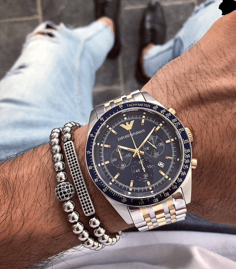 Emporio Armani AR8030 worn on wrist with blue dial and two-tone silver and gold-tone strap