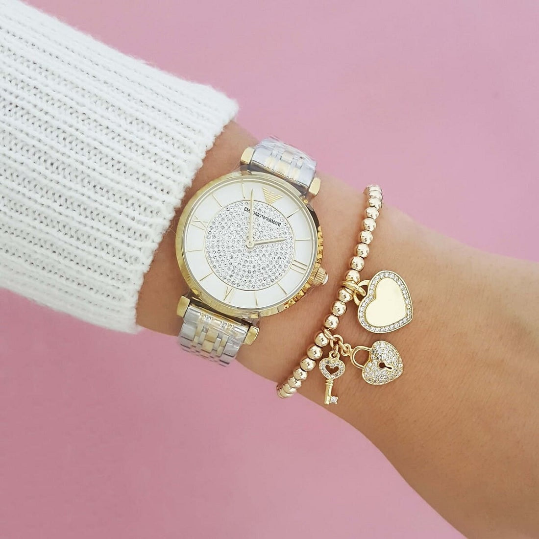 Emporio Armani AR8031 worn on wrist with white pave crystal dial and two-tone silver and gold-tone strap