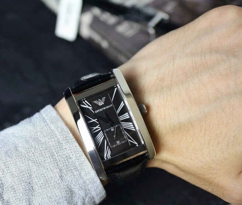 Emporio Armani AR0143 rectangular watch worn on wrist with black leather strap 