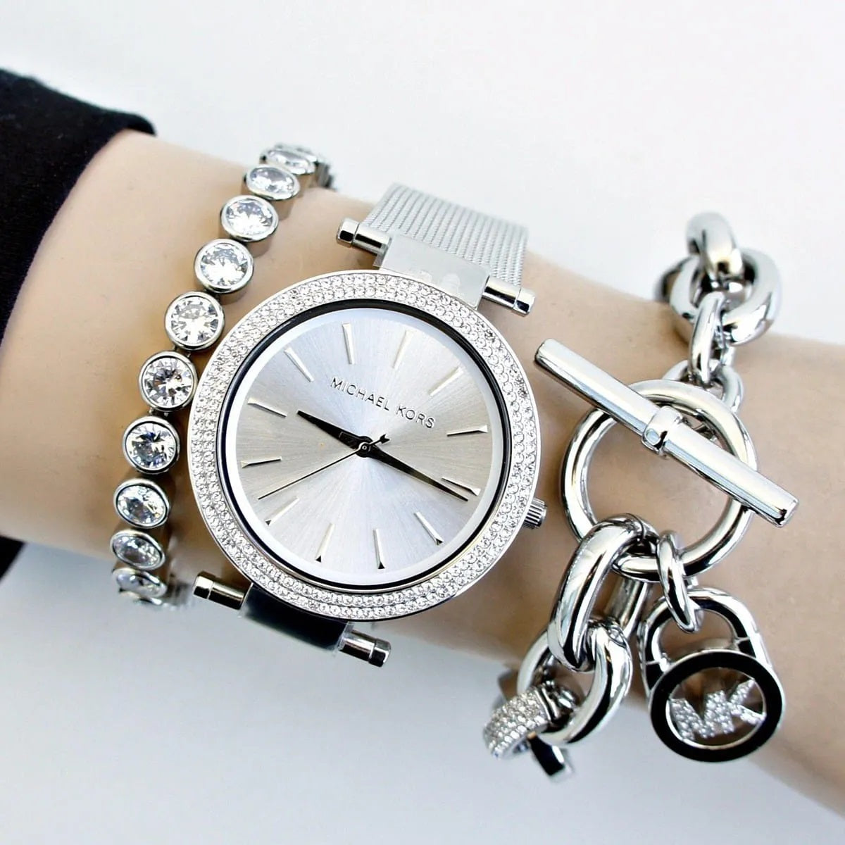 Michael Kors MK3367 worn on wrist, showcasing its silver dial and mesh strap