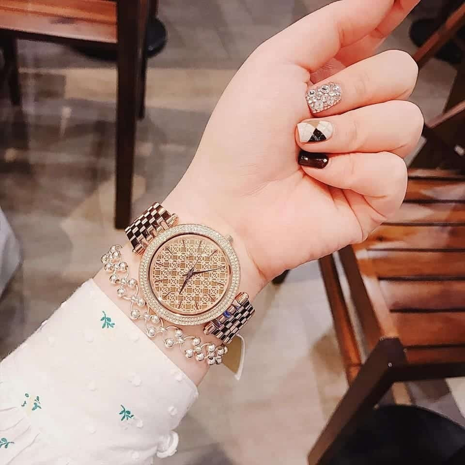 Michael Kors MK3399 worn on wrist, showing elegant crystal dial and rose gold strap
