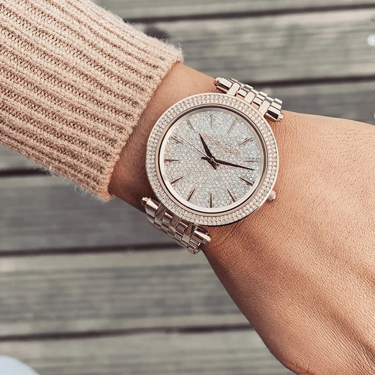 Close-up on wrist of Michael Kors MK3439 showing intricate pavé crystal dial