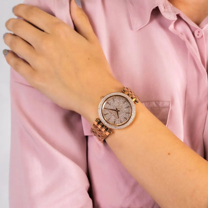 Michael Kors MK3439 worn on wrist, highlighting pavé crystal dial and rose gold strap