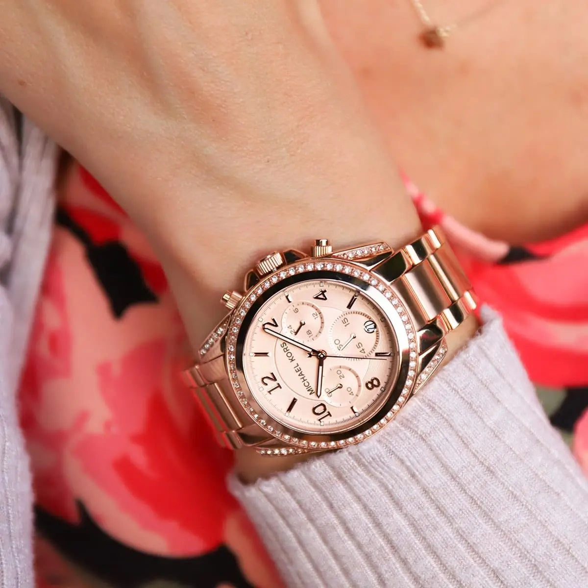 Close-up of Michael Kors MK5263 worn on wrist showing sparkling crystals and rose gold dial