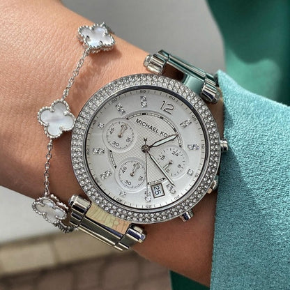 Close-up on wrist of Michael Kors MK5353 with silver dial and crystal bezel
