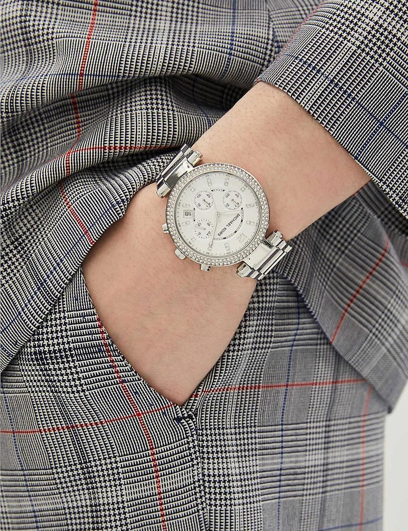 Wider wrist view of Michael Kors MK5353 showcasing full silver design and crystal highlights