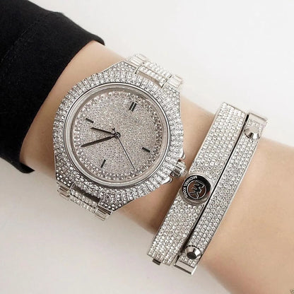 Michael Kors MK5869 women's silver-tone watch with pavé crystal dial worn on wrist