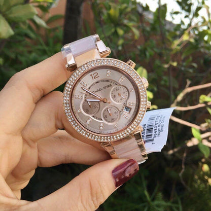 Detail of the dial on Michael Kors MK5896 with its rose gold markers and hands