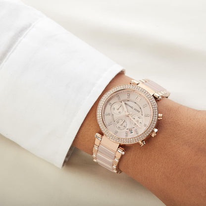 Michael Kors MK5896 women's rose gold watch worn on wrist showcasing its full design