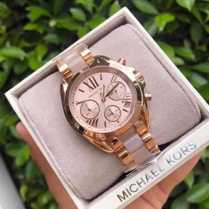 Close-up of case and lugs on Michael Kors MK6066 women's rose gold stainless steel watch