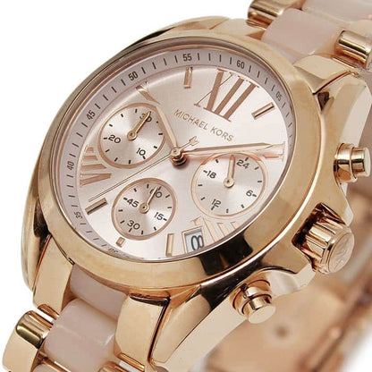 Close-up of rose gold dial on Michael Kors MK6066 women's stainless steel watch