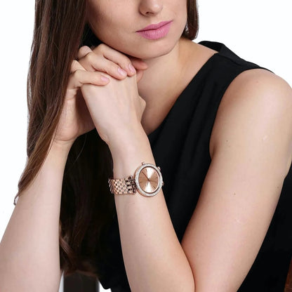 Angled view of Michael Kors MK3192 women’s watch worn on wrist, highlighting the elegant rose gold strap and crystal-embellished rose gold dial