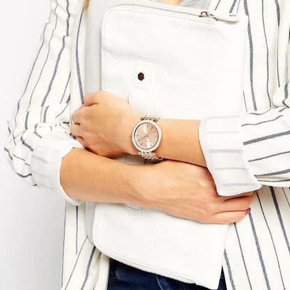 Michael Kors MK3192 women’s watch worn on wrist, featuring a stunning rose gold dial and matching rose gold strap with crystals for added elegance