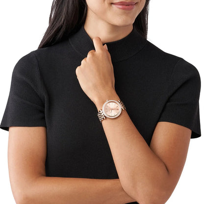 Michael Kors MK3192 women's watch worn on wrist, highlighting the rose gold strap and rose gold dial with crystals