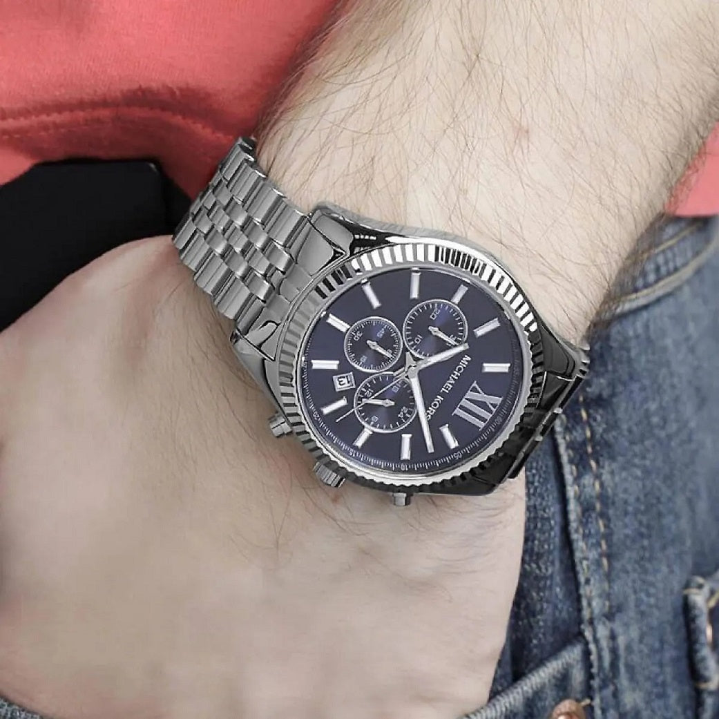 Michael Kors MK8280 men's stainless steel watch with blue dial worn on wrist