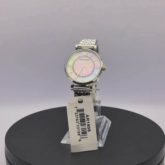 360-degree rotating view of Emporio Armani AR1908 women's silver stainless steel watch with white mother-of-pearl dial and mesh bracelet.
