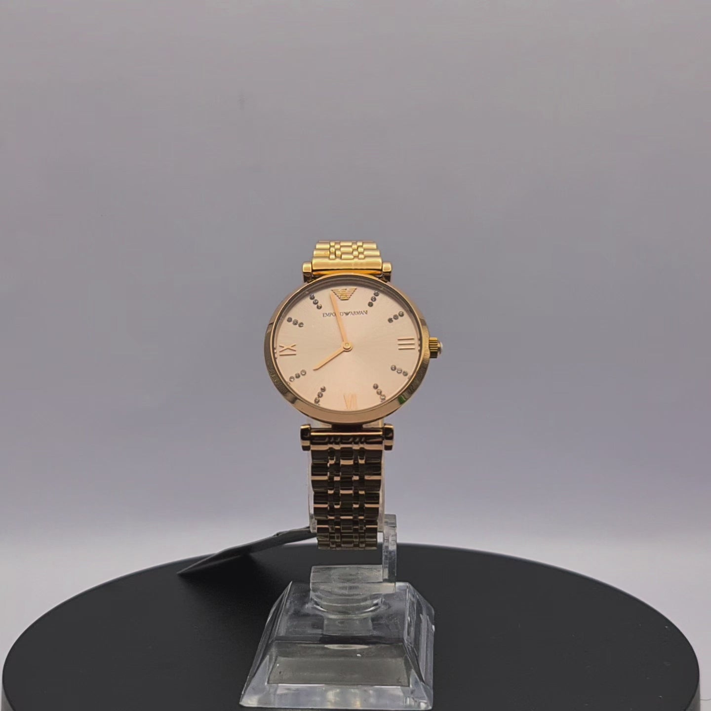 360-degree rotating view of Emporio Armani AR11059 women's rose gold stainless steel mesh watch with silver dial.