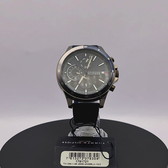360-degree rotating view of Tommy Hilfiger 1791721 Bank watch with gunmetal case and blue silicone strap.