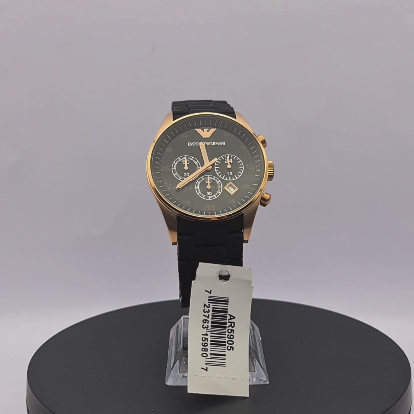 360-degree rotating view of Emporio Armani AR5905 men's rose gold and black chronograph watch with black silicone-wrapped bracelet.