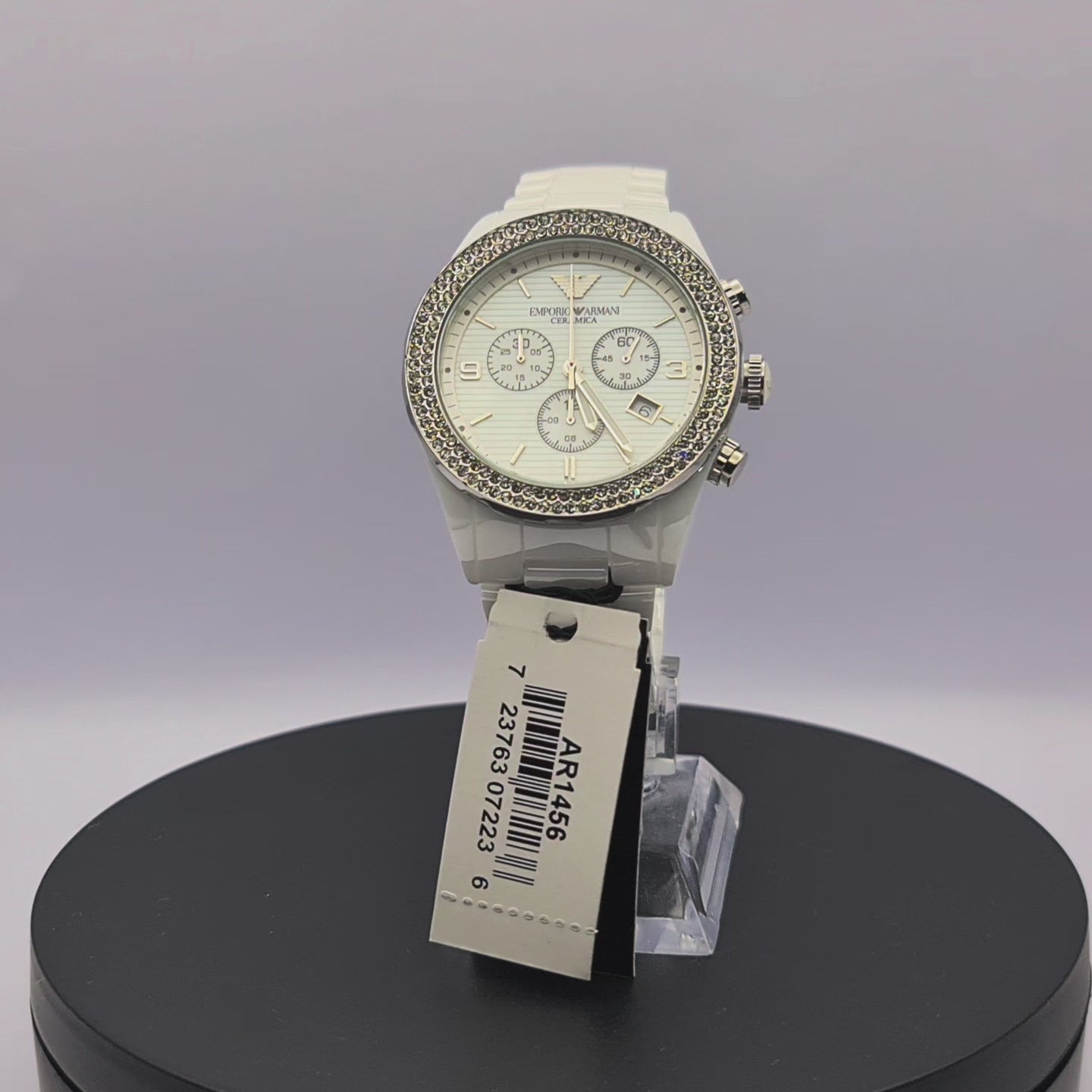 360-degree rotating view of Emporio Armani AR1456 women's white ceramic chronograph watch with mother-of-pearl dial and crystal hour markers.